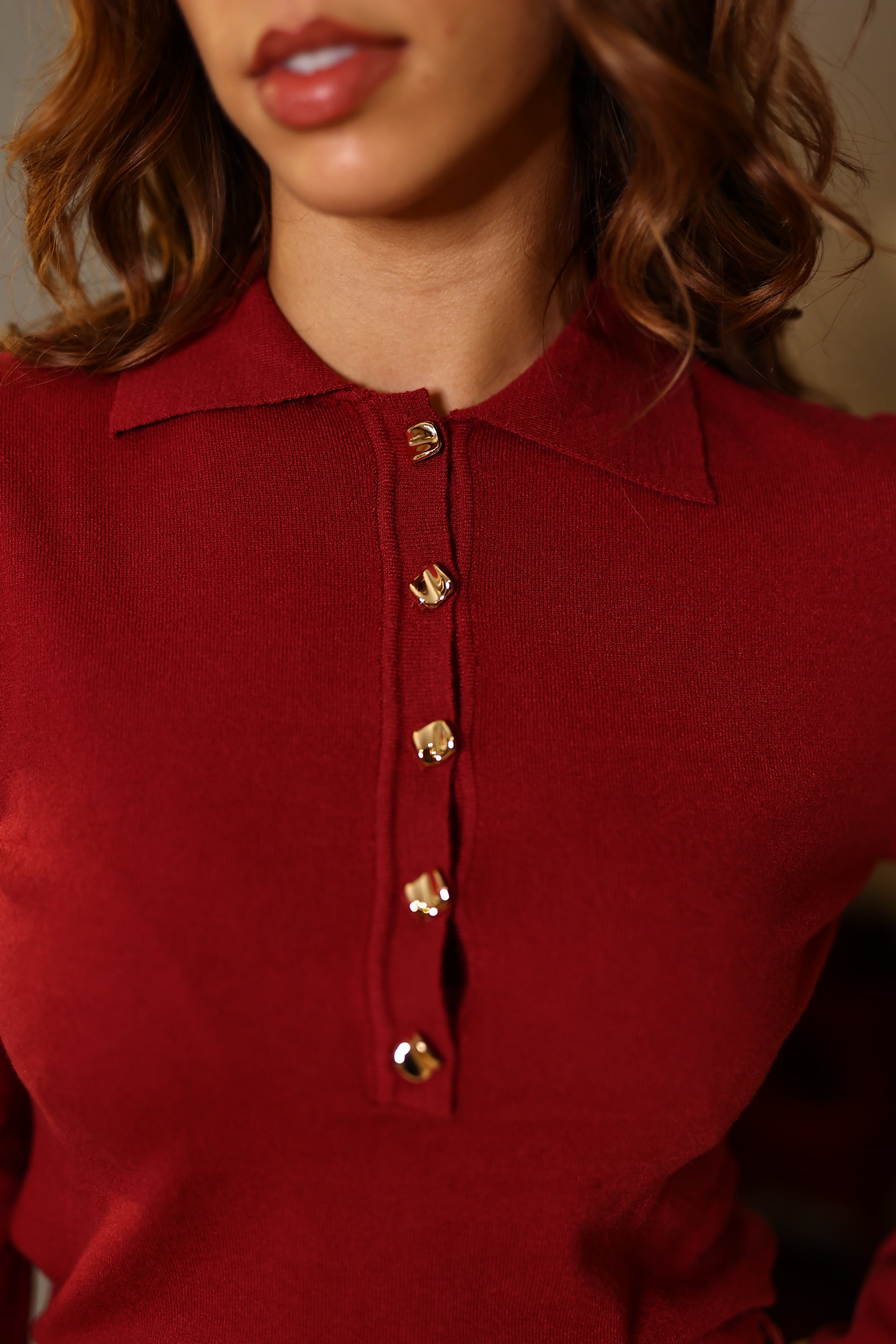 Polo com botões dourados